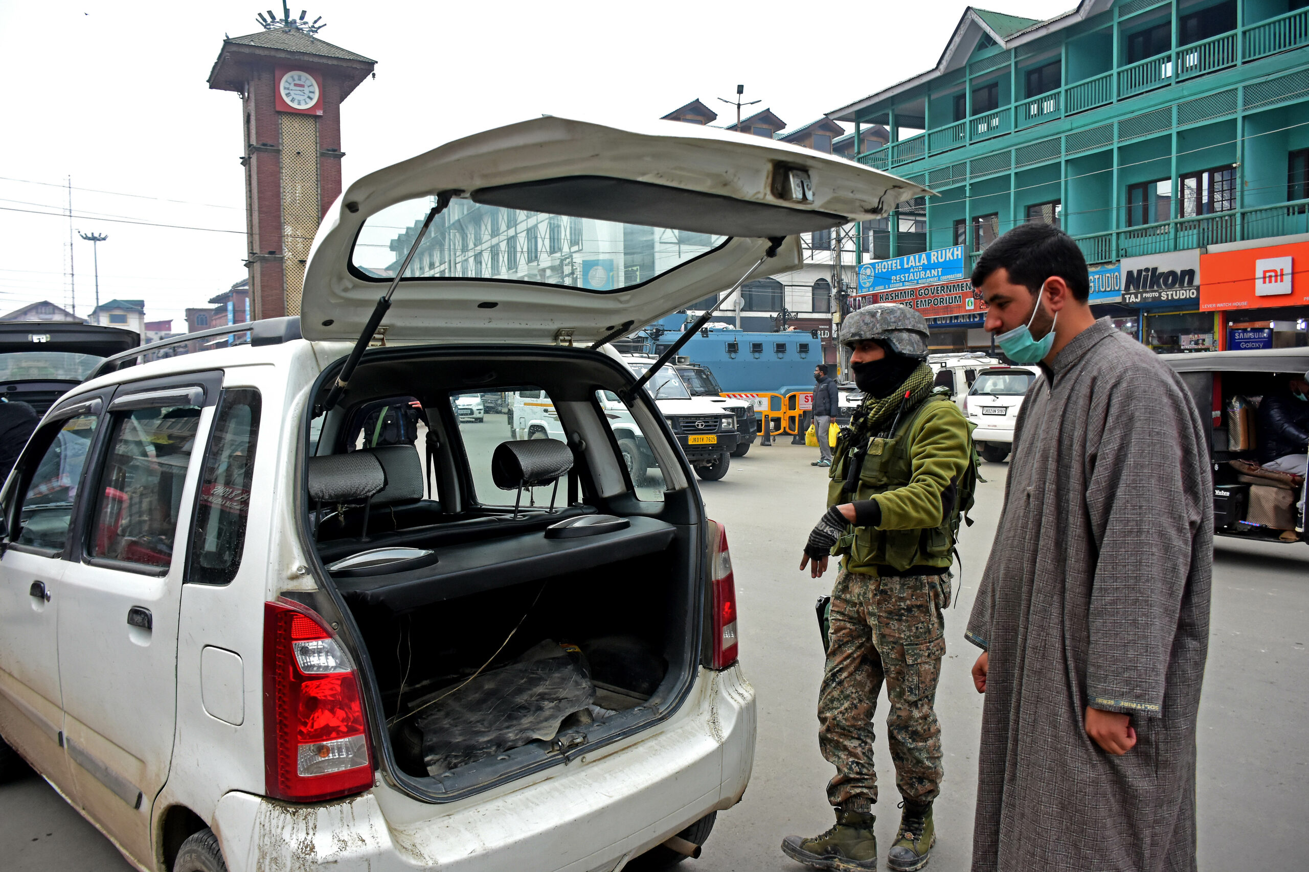 Security-Forces-searching-vehicles-during-frisking-ahead-of-26th-January-at-Clock-Tower-Lal-Chowk-Srinagar-1-scaled